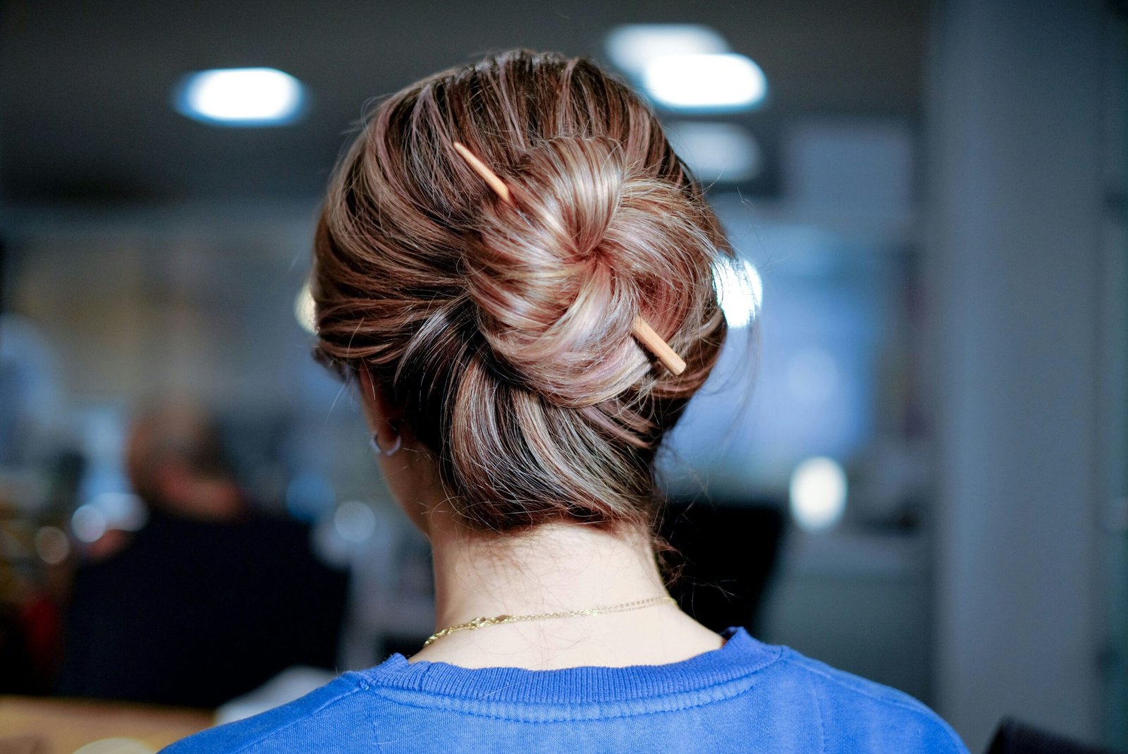 woman wearing blue top inside room